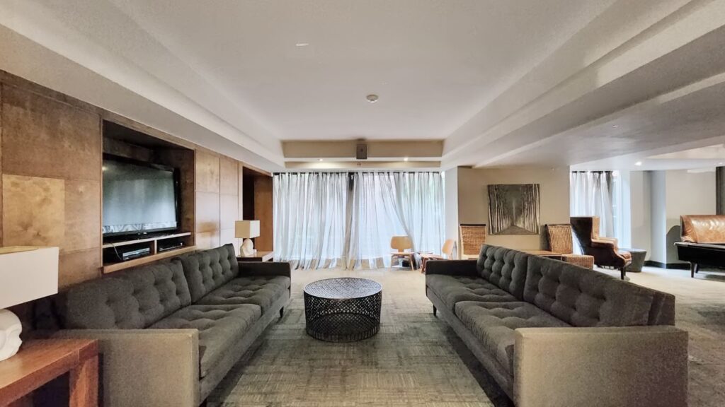 Games room at Eleven Residences, 11 St Joseph St, equipped with a pool table and lounge seating, providing a fun and social space for residents to unwind.