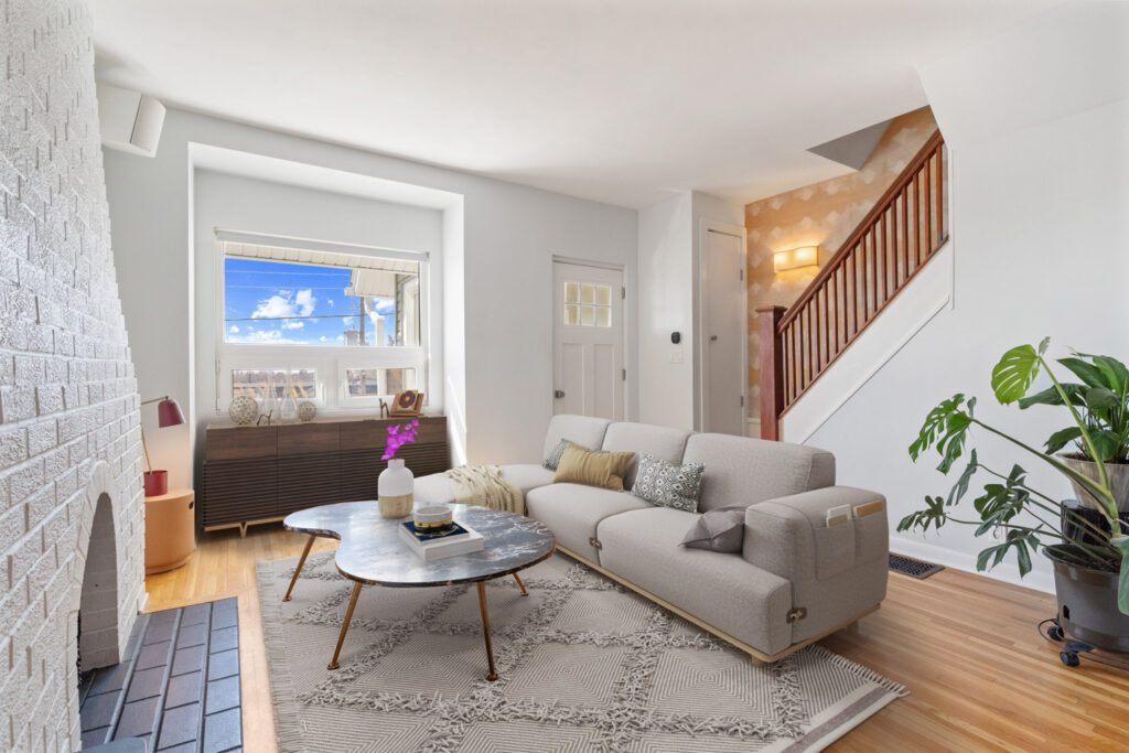 Bright living room at 1370 Davenport Rd featuring CN Tower views, hardwood floors, built-in speakers, and open-concept layout.