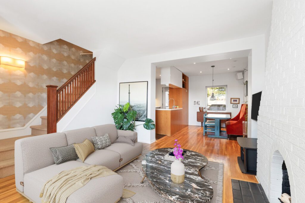Open-concept living and dining area at 1370 Davenport Rd with CN Tower views, hardwood floors, and seamless flow for entertaining.