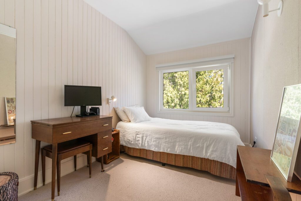 Third bedroom at 1370 Davenport Rd with view of the fully fenced backyard, large window, and versatile layout for office, nursery, or guest room.