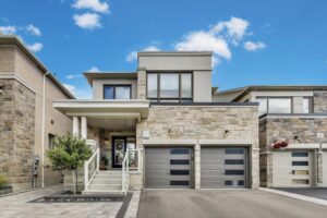 Front exterior of 59 Maskells Cres, Whitby-California-modern facade with large windows and interlock driveway
