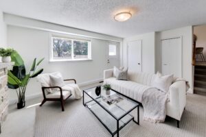 Bright family room with large window and fireplace at 22 Crossbow Crescent in Pleasant View, Toronto