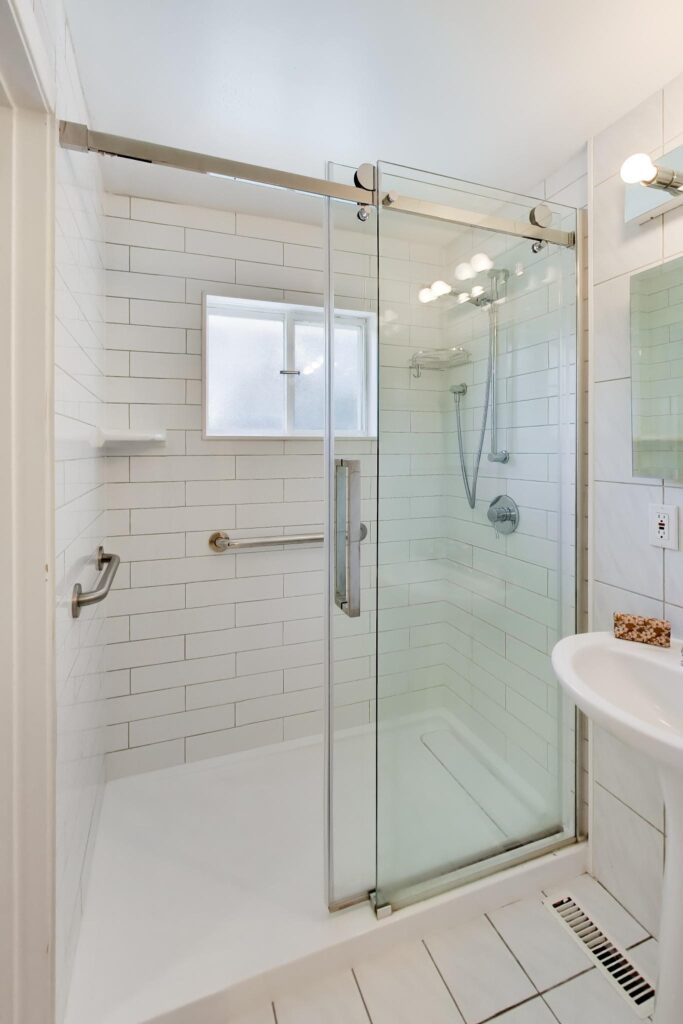 Updated walk-in shower with glass enclosure at 22 Crossbow Crescent in Pleasant View, Toronto