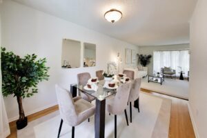 Dining room with seating for six and views toward the kitchen at 22 Crossbow Crescent in Pleasant View, Toronto
