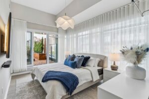 Primary bedroom with terrace access at 10 Graphophone Grove #702, Toronto